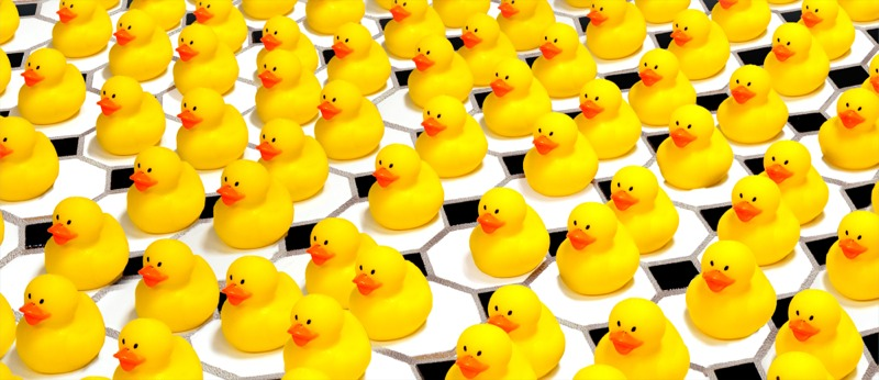 Artistic representation of an imperfect crystal, with repeating units portrayed as a series of infinite ducks. Credit: SLAC National Accelerator Laboratory.